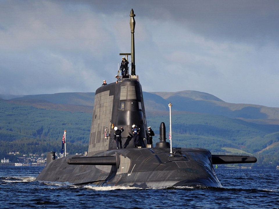 NUCLEAR powered submarine HMS Ambush yesterday steamed to Gibraltar  in a massive show of force against greedy Spain.