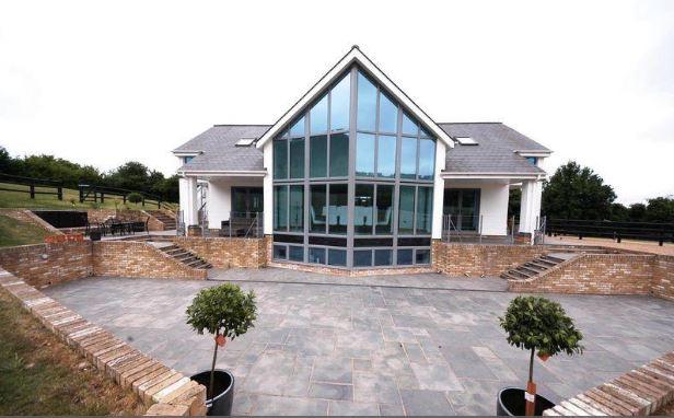 He came home to find the glass-fronted pad – which boasted a cinema - up in flames