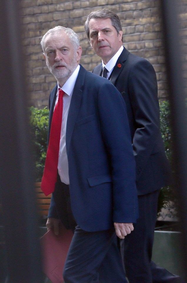 Britain's opposition Labour party leader Jeremy Corbyn walks through Portcullis House to attend a meeting at the House of Commons in London