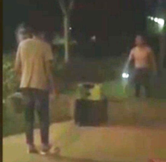The chilling footage, taken at the scene and published by People's Daily China, shows passers-by looking panic stricken as a voice shouting 'help me' is heard from inside the suitcase