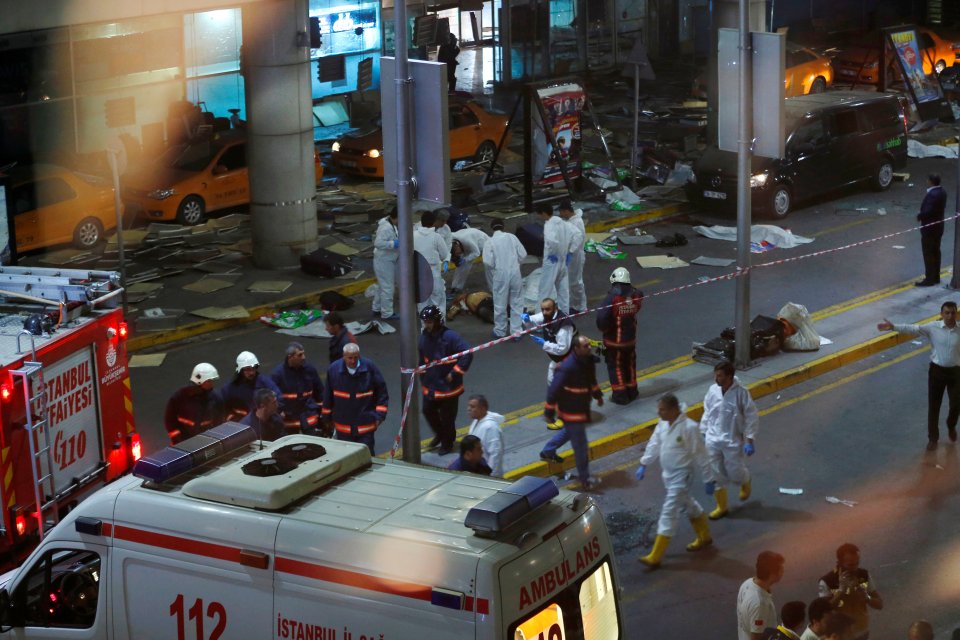 Forensic experts work outside Turkey's largest airport following a blast