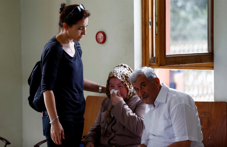 Sacide Bugda, the mother of Abdulhekim Bugda who was one of the victims of yesterday's blast at Istanbul Ataturk Airport, is comforted by her relatives as she waits in front of a morgue in the city