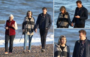 Taylor Swift looks distinctly unimpressed as she strolls along beach with Tom Hiddleston and his mum