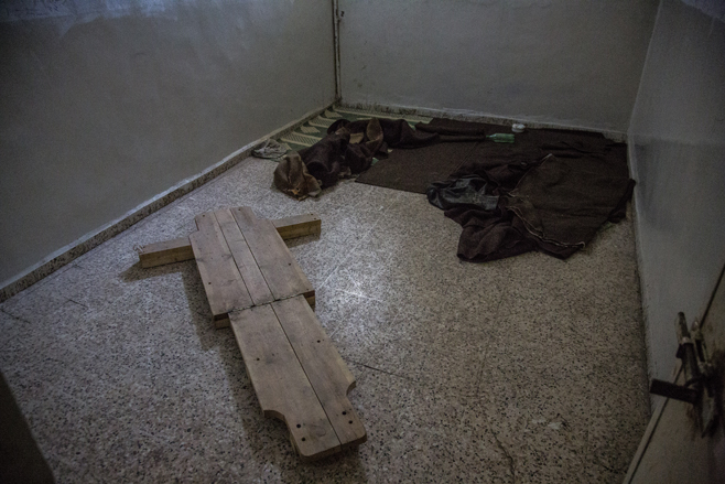 4/24/2013 RAqqa, Syria A torture device sat abandoned on the floor of an Assad Regime State Security building, in Raqqa, Syria.