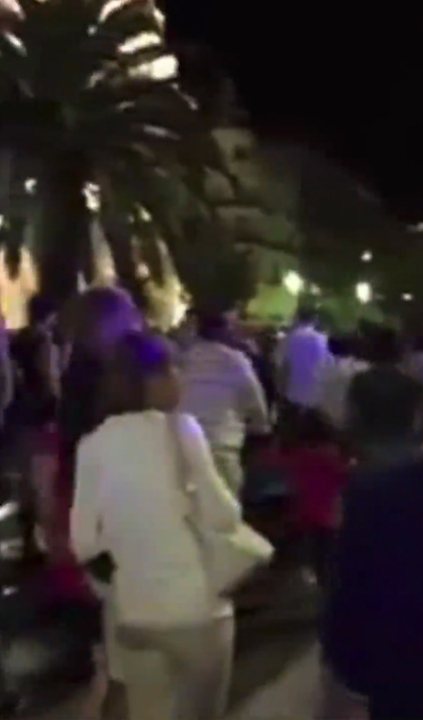 People are seen happily walking through the streets before the murderous rampage
