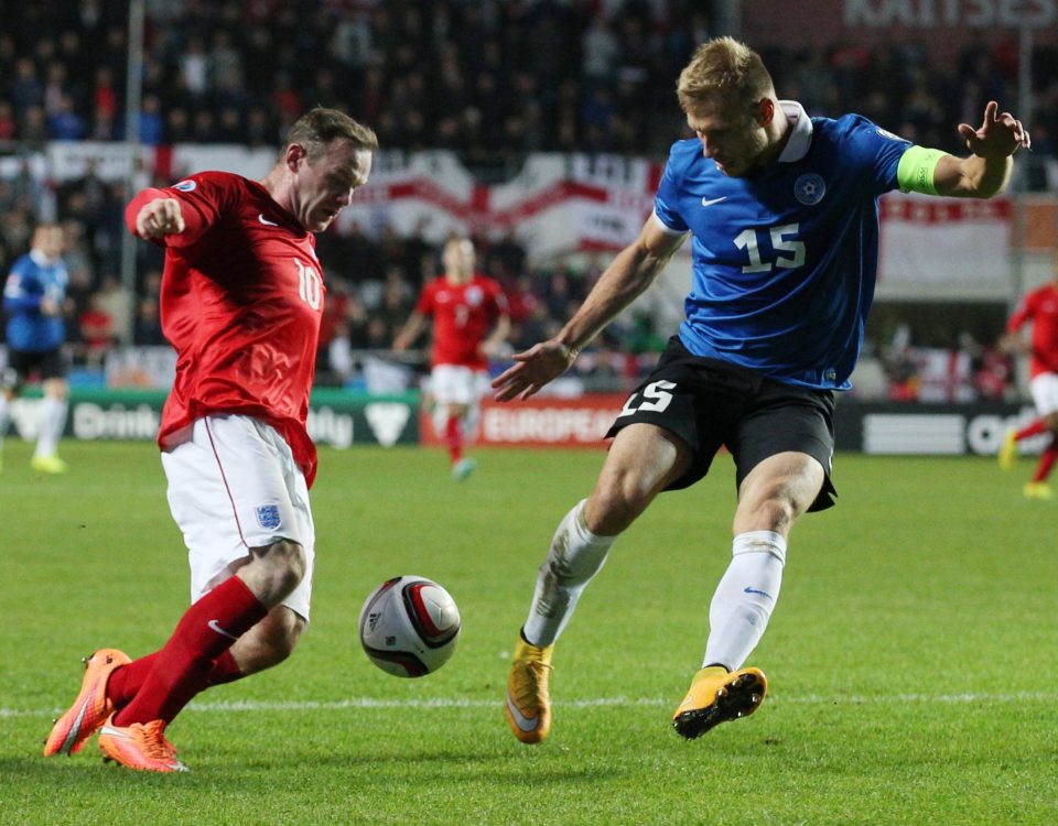 The Estonia captain vies for the ball with Wayne Rooney during a Euro 2016 qualifier