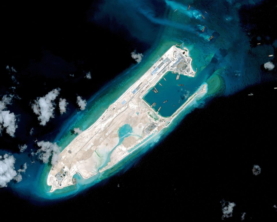 A satellite image from April last year shows what is claimed to be an under-construction Chinese airstrip at the top end of Fiery Cross Reef in the Spratly Islands of the disputed South China Sea