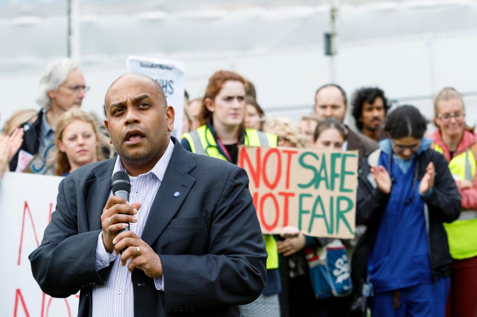 Bristol, UK, 10th October, 2015. Bristol, UK, 10th October, 2015. Dr. Johann Malawana (Chair of the BMA Junior Doctors&apos; Committee) is pictured as he speaks to protesters at the end of the save our NHS protest march and rally in Bristol. The mar