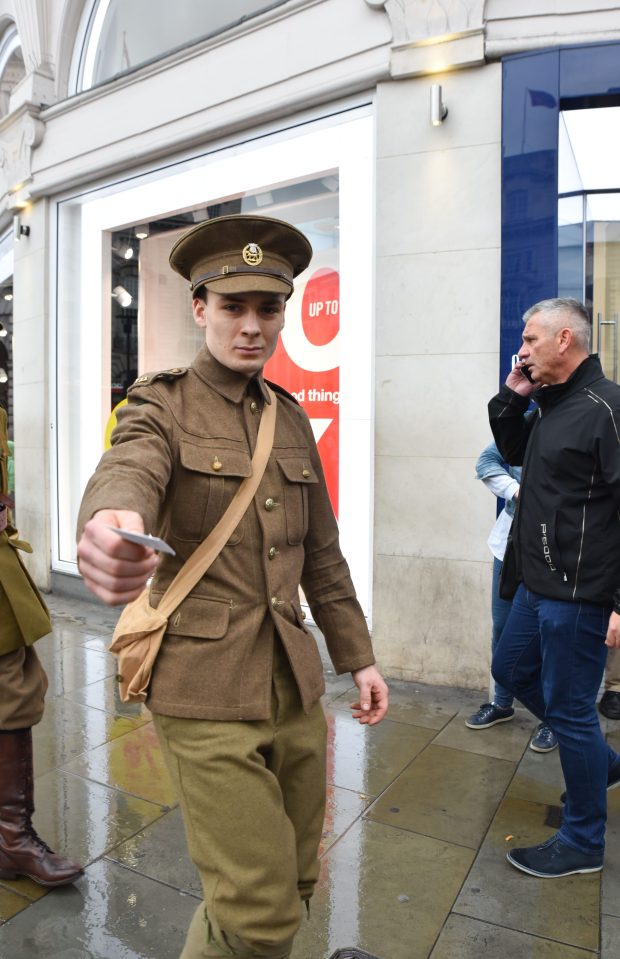 Handing out cards with details of fallen men left many commuters emotional