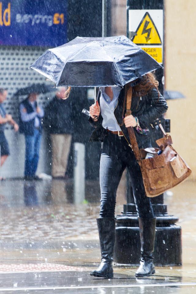 Manchester, UK. 1st July, 2016. UK Weather: Torrential heavy downpours of rain soak shoppers in Manchester City Centre. The unsettled weather across the north west of England caught shoppers by surprise with heavy outbursts of rain this afternoon.