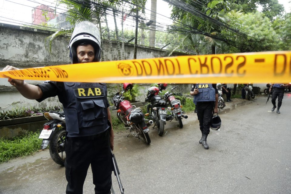 Members of Bangladesh's Rapid Action Battalion this morning cordoned off the scene of the shootout