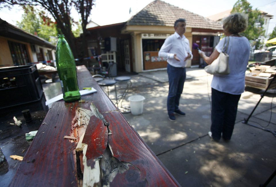 A man is interviewed at the scene of the shooting