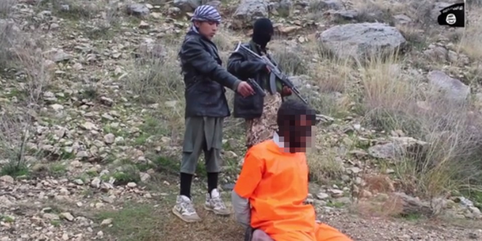 It cuts to the child aiming at the back of his head while an adult stands guard