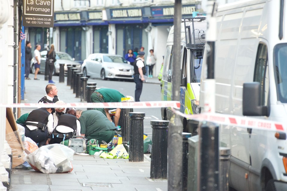 paramedics treat the victim