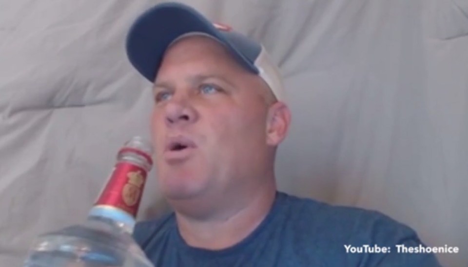 The video maker readies himself to down the 'booze' all in one go