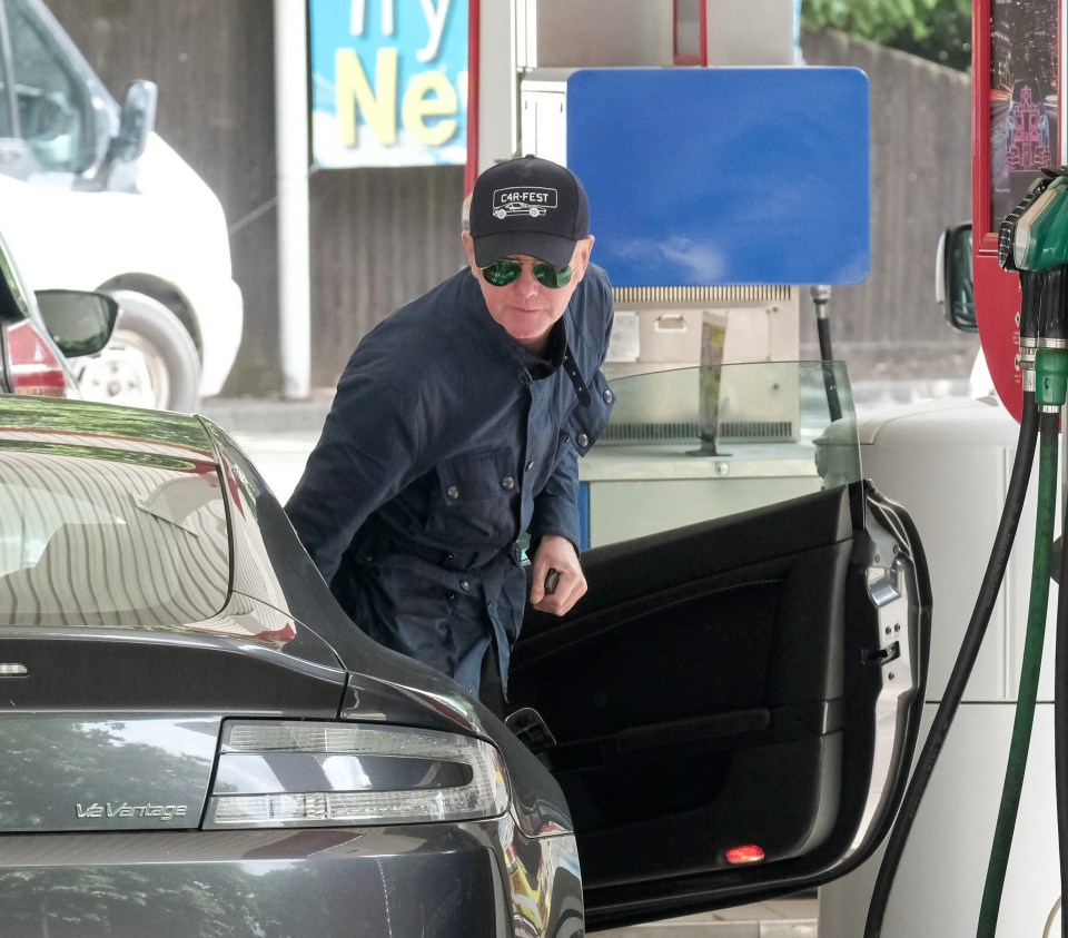 Evans was spotted filling up his Aston Martin at a service station in London today