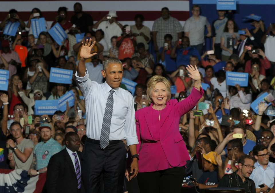 U.S. President Obama stands with Democratic U.S. presidential candidate Clinton at campaign event in Charlotte, North Carolina