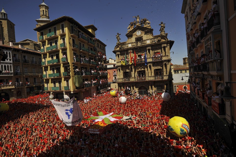 Seeing red: The city's main square is overflowing with people drenching each other in wine