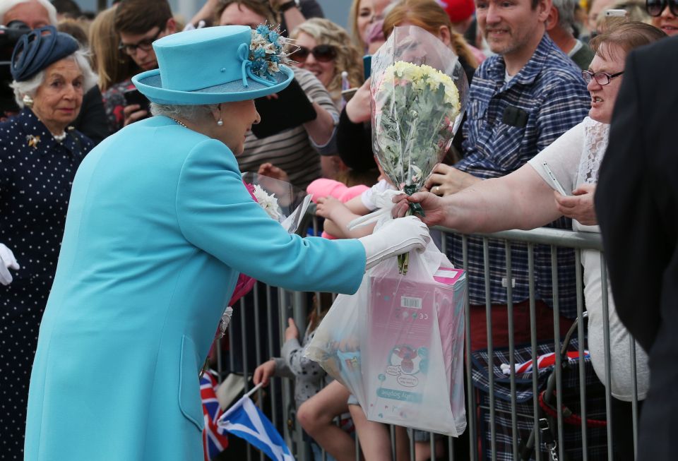 Although on second glance the Queen looked delighted with the present, which appeared to be a child's doll along with a toy from hit kid's move Toy Story