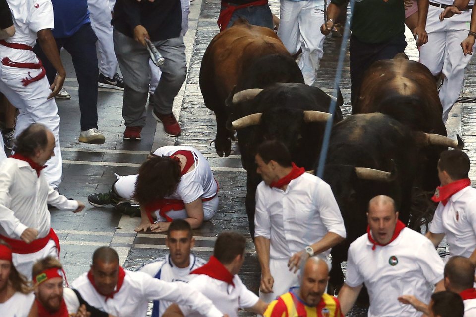 Four people were injured as they ran from the bulls with three suffering head injuries and another suffering an arm injury