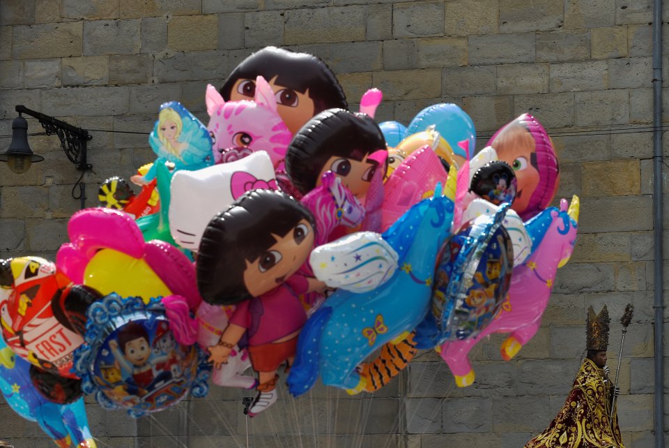 Tourists can treat themselves to toys and balloons including Dora the Explorer during the festival