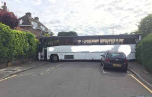 Bus gets wedged in cul-de-sac after driver's over-ambitious three-point turn