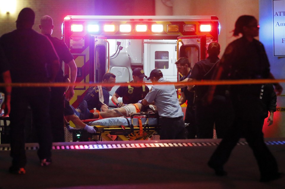 A victim is treated by paramedics as emergency services race to save those injured during the rampage