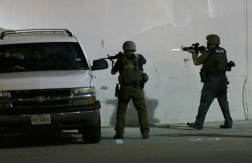 Heavily-armed SWAT teams descended on the city to regain some order as it emerged at least one of the attackers was wearing armour
