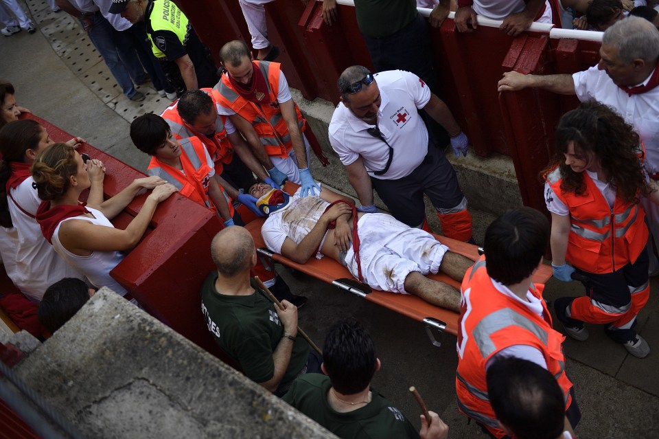 The annual event often sees participants injured as they try to avoid the charging bulls