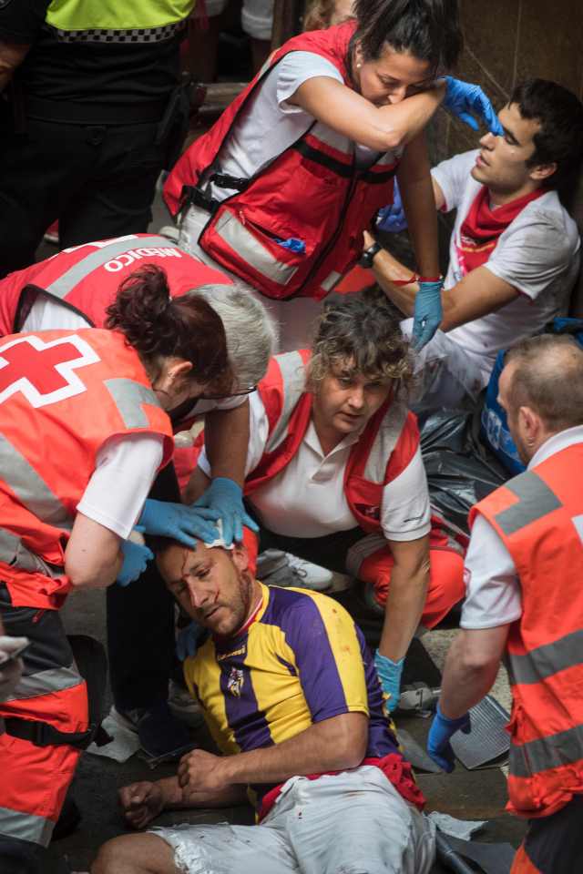 Medics attend to yet another injured participant. Seven were injured during Friday's run