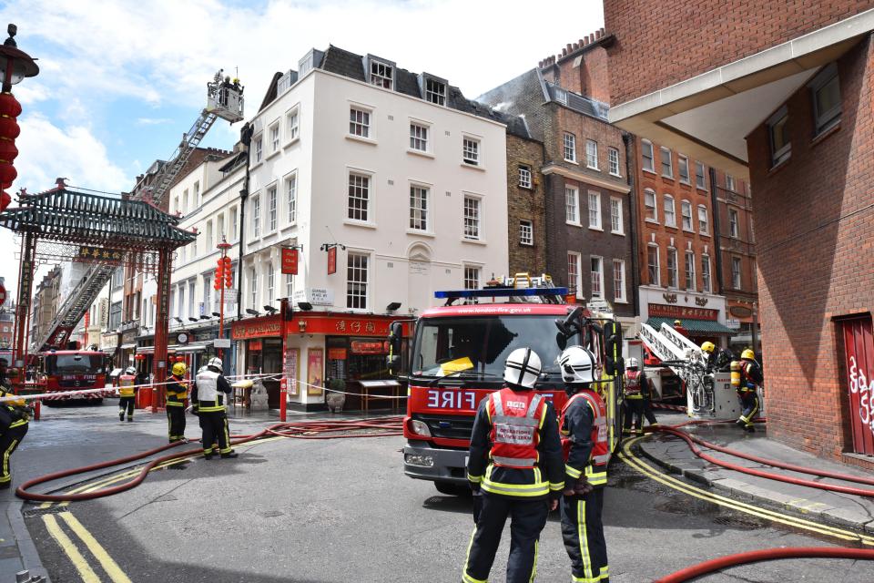 Gerrard Street, London, UK. 10th July 2016. Fire engines attend to a fire above restaurants on Gerrard Street in Chinatown ¿ Matthew Chattle/Alamy Live News