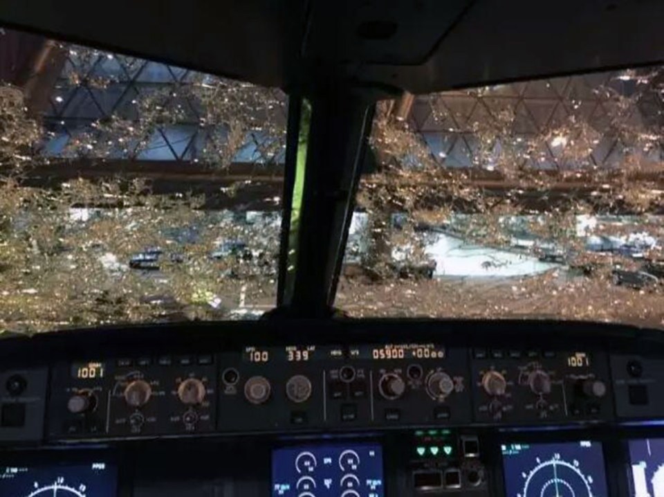 It was virtually impossible to see out the plane's front window after hail damaged the glass