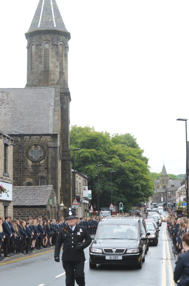 Over 150 teachers and firefighters, who were on a nearby job at the time, also stood to attention