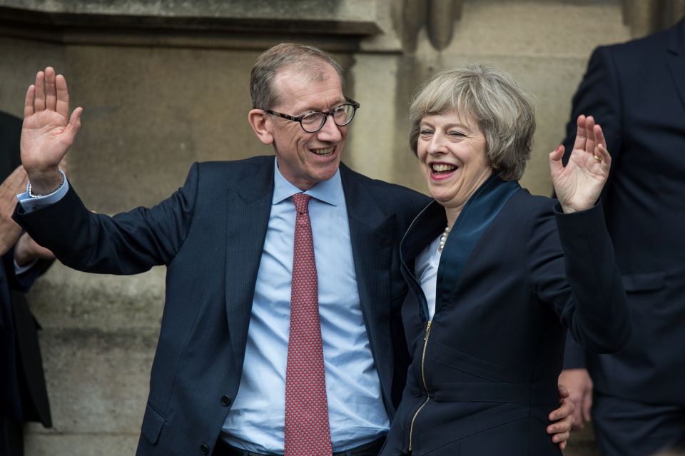 May waved to media, supported by her husband Philip in making the historic announcement