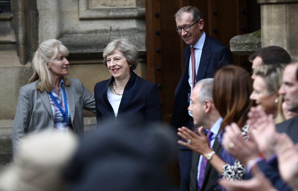 Flanked by dozens of MPs, May committed to a strong leadership to guide Britain through a period of uncertainty
