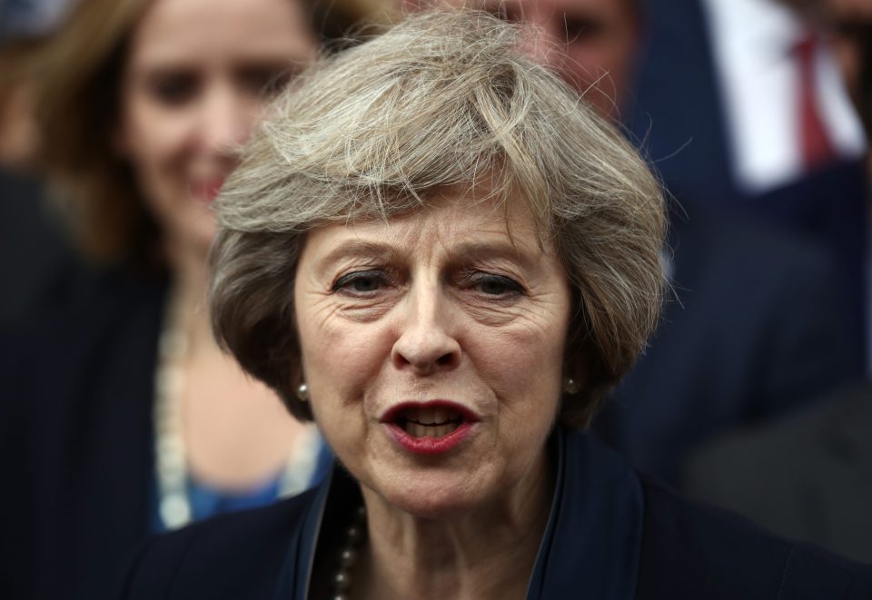 May pledged to build a better Britain, committing to Brexit as she accepted taking on the top job