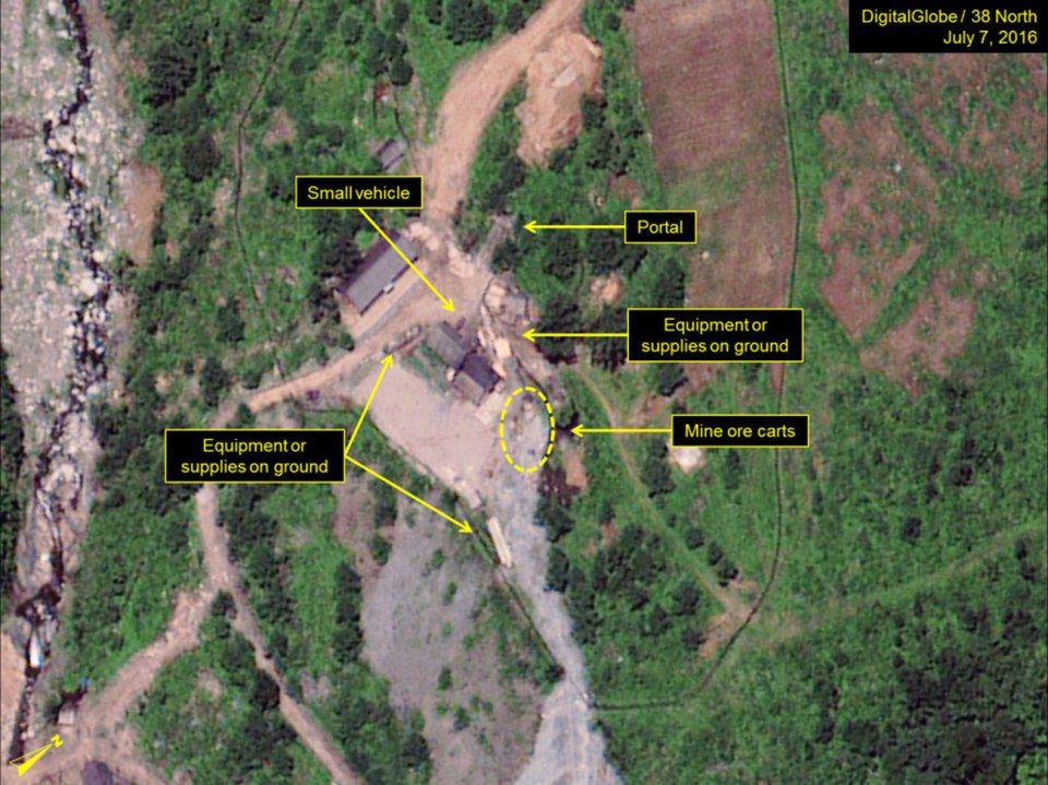 The North Portal: Vehicles, equipment and iron ore carts suggest tunnel work is underway