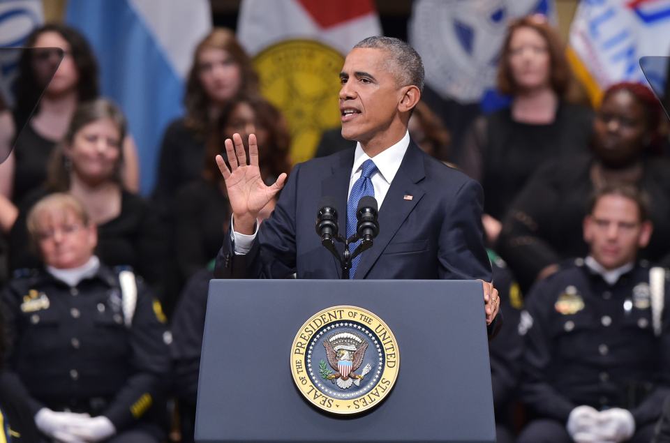 US President Barack Obama pauses while speaking at cop memorial in Dallas