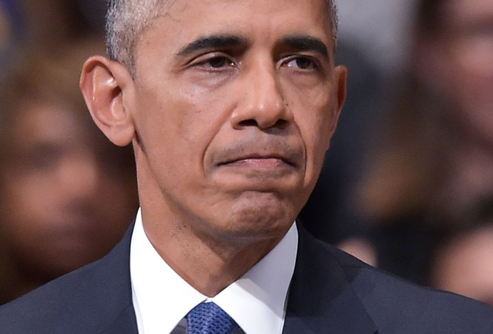 US President Barack Obama pauses while s
