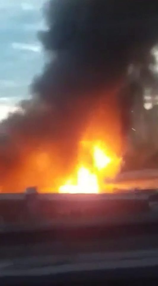 Flames billow from the Cafe Nero factory in Clapham