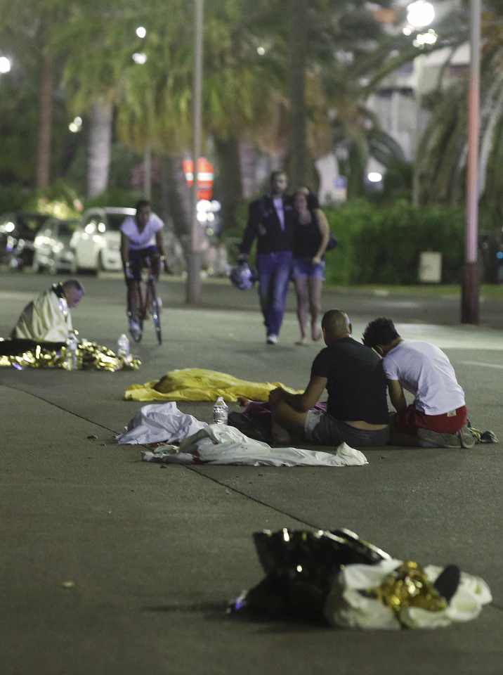 Bodies are seen on the ground after at least 30 people were killed in the southern French town of Nice when a truck ran into a crowd celebrating the Bastille Day national holiday