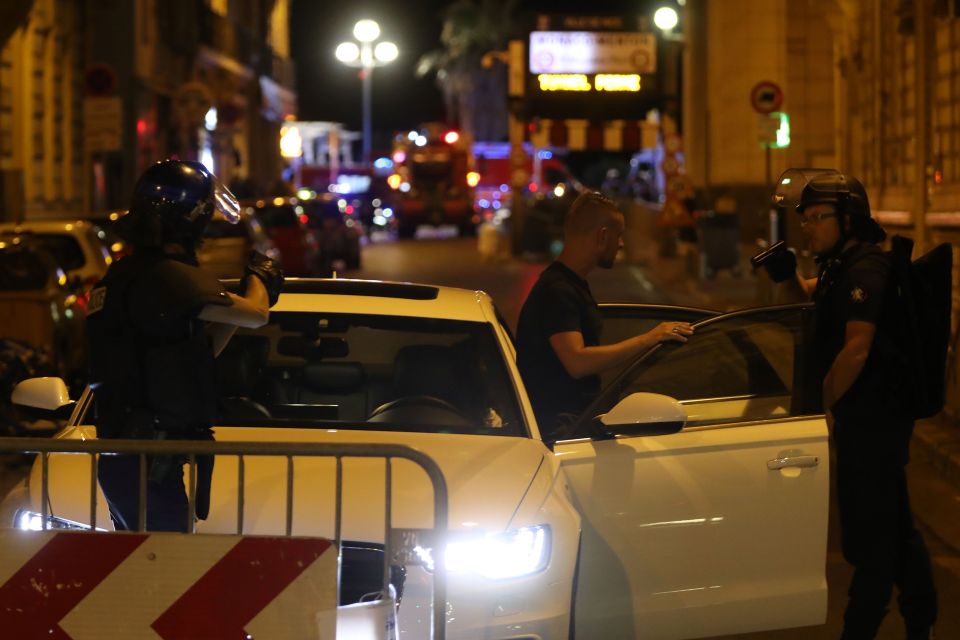 Police officers carry out checks on vehi