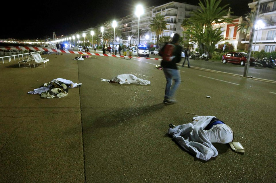 Bodies are seen on the ground after at least 30 people were killed in the southern French town of Nice when a truck ran into a crowd celebrating the Bastille Day national holiday