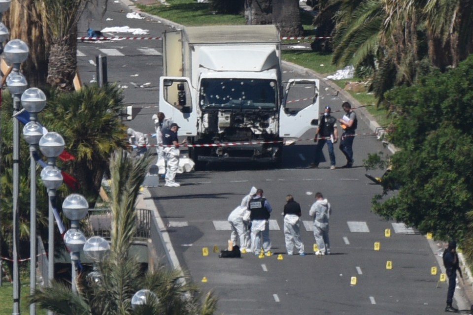 Police forensic officers work at the scene of the horrifying attack in Nice