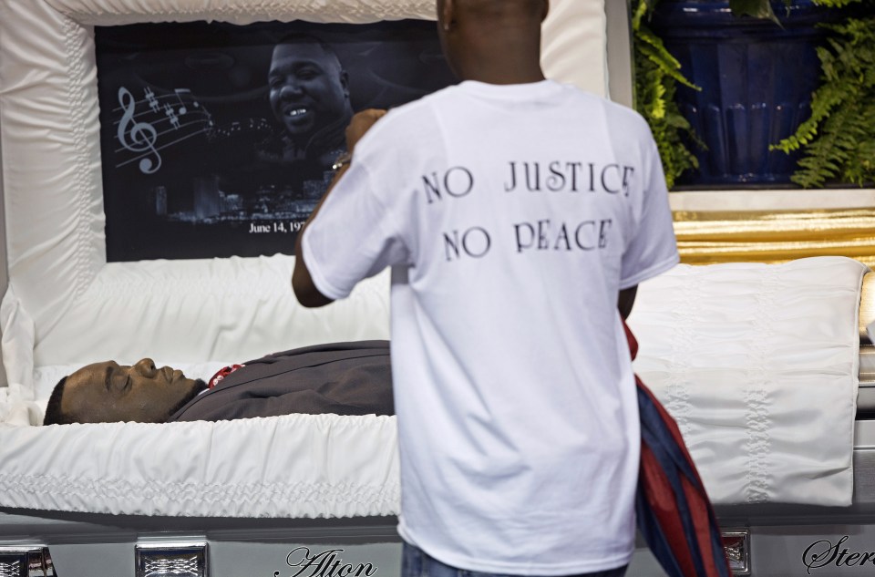 Mourners pay their respects as they attend the funeral of Alton Sterling, in Baton Rouge