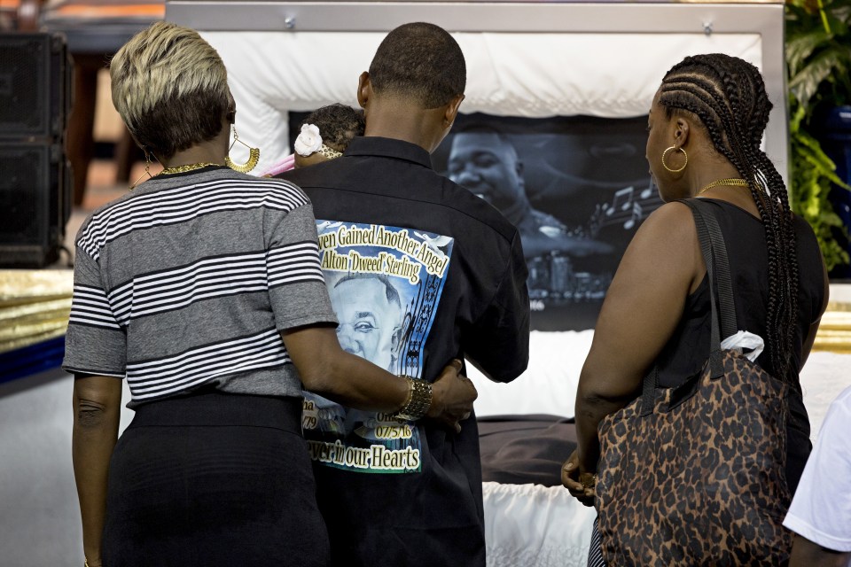 Mourners pay their respects as they attend the funeral of Alton Sterling, in Baton Rouge