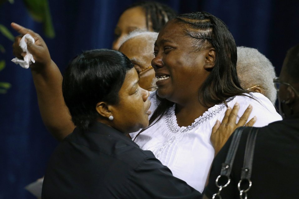 Mourners pay their respects as they attend the funeral of Alton Sterling, in Baton Rouge