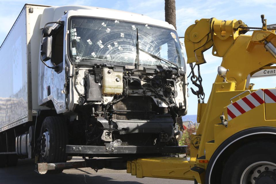 The truck that was driven by Mohamed Lahouaiej Bouhlel through a crowd celebrating Bastille Day being towed away by breakdown lorry 