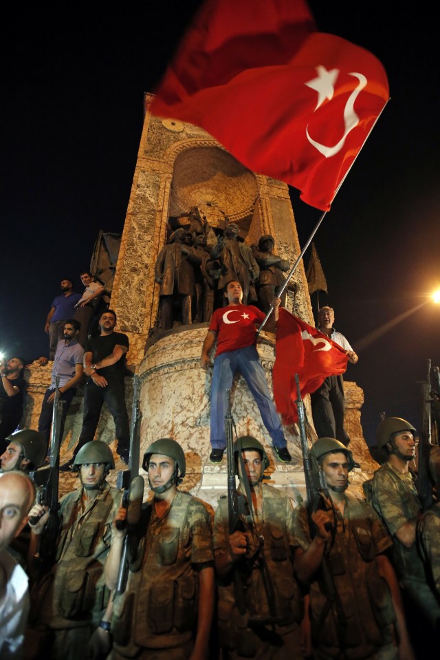 Supporters of President Erdogan protest in Istanbul's Taksim square after he called on them to show their opposition to the coup