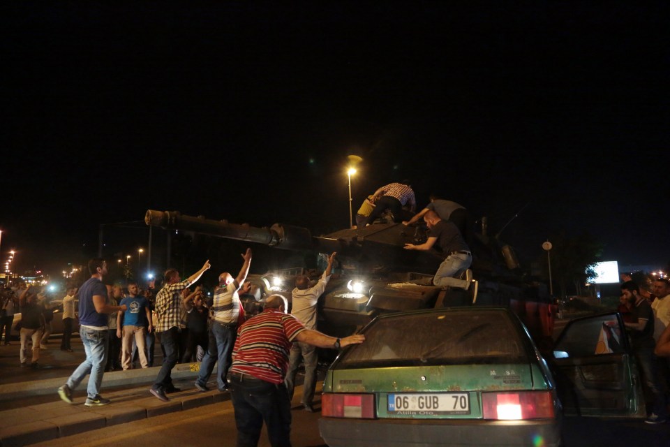 Protesters have clambered onto the tanks 